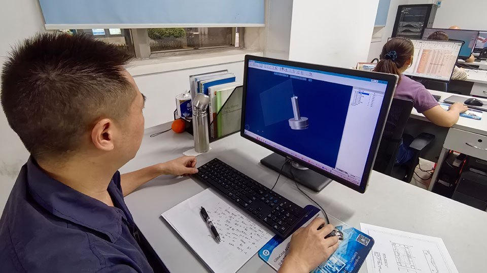 A Luxottica engineer developing customized MTM programs using GibbsCAM.